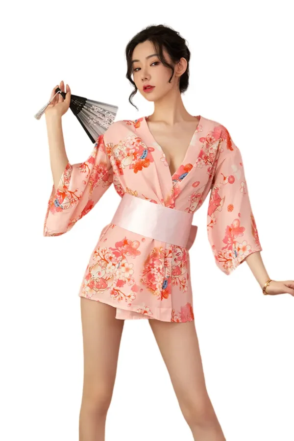 Model posing in pink OEM Japanese kimono lingerie holding a fan