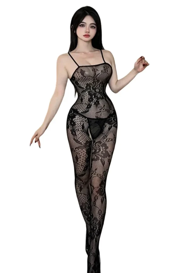 Model posing in a private label body fishnet lingerie bodysuit with floral accents.