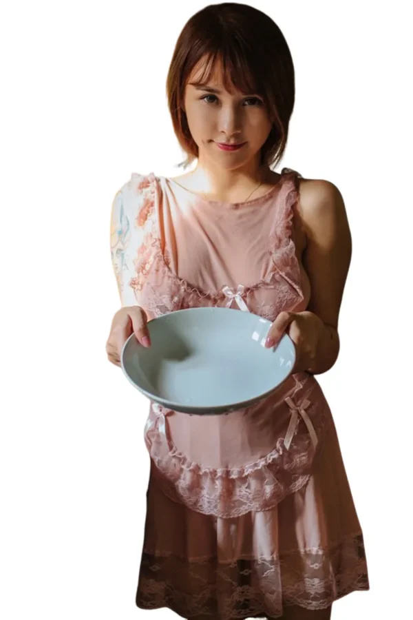 Woman wearing a private label sexy maid costume with apron design, holding a bowl.