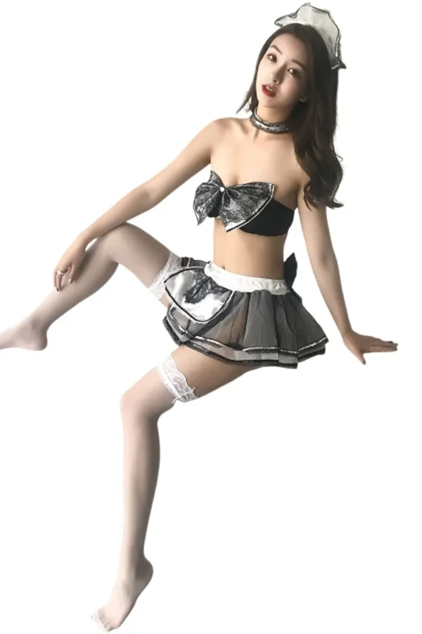 Woman posing in complete custom sexy loungewear plus set with lace bow, sheer skirt, and matching headband.