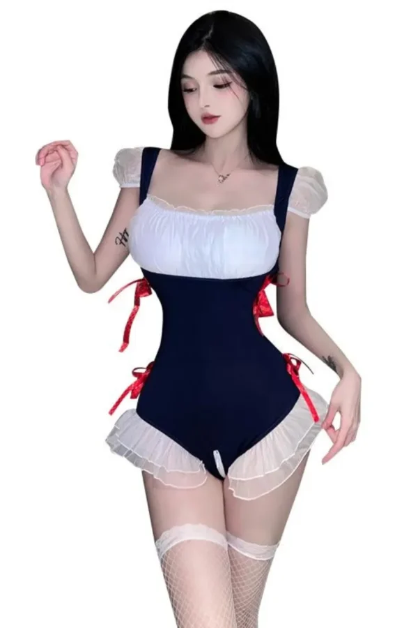 Model in a navy blue wholesale French maid costume with white lace and red ribbon accents