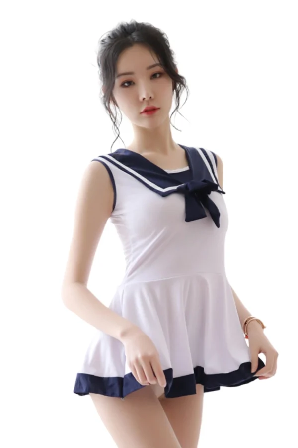 A model wearing bulk naughty School girl sexy lingerie in a white dress with navy sailor details.