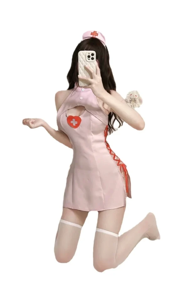 A model wearing a custom sexy nurse uniform with a heart-shaped cutout and lace-up side detailing.