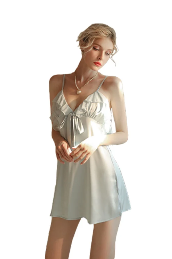 A model in a white B2B lace silky nightgown with elegant front bow detailing.