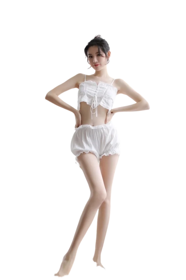 Elegant woman posing in a graceful white bulk lace and silk nightgown.