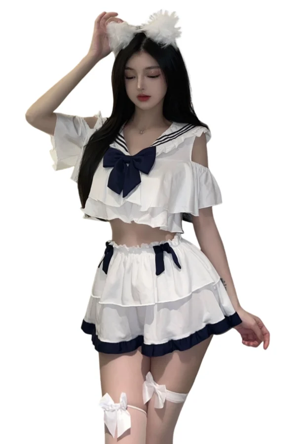 Front view of a naughty school bodysuit lingerie in white with a blue bow, available for wholesale.