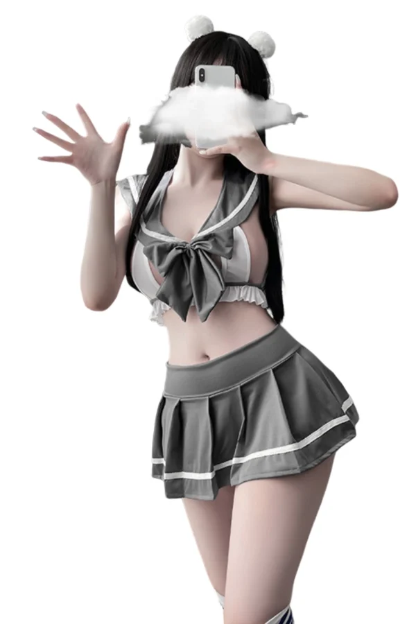 A full-body view of the OEM nude naughty school lingerie, showcasing a sailor-style top, bow detail, and pleated skirt.