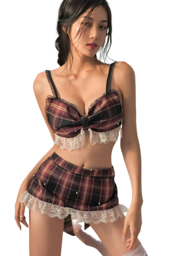A model wearing private label body naughty school lingerie in a plaid design with lace details.