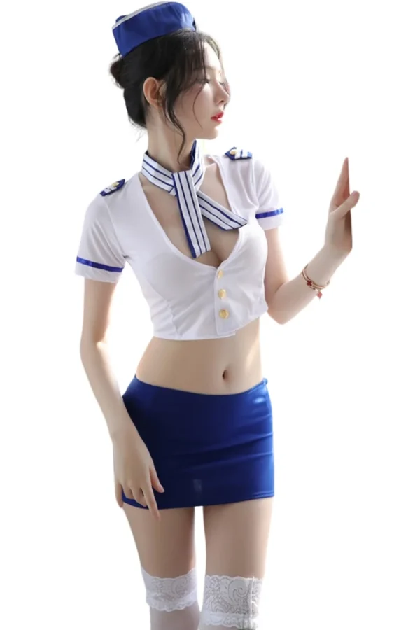 Woman posing in private label flight attendant costume with white top and matching accessories.