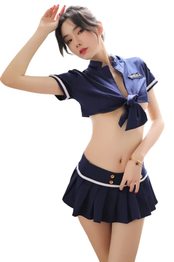 Stylish Private Label Lady Cop Costume in Navy Blue - Supreme Lingerie A model wearing a navy blue private label lady cop costume with a tied top and pleated skirt.